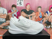 Side profile of a white Nike Kobe basketball shoe with visible Swoosh and signature details