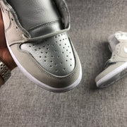 Close-up of the perforated toe box and layered grey upper panels.