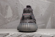 Rear view showing the padded heel collar, pull tab and ribbed outsole.