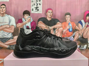 Black lace-up basketball sneaker shown from the side, highlighting layered panels and a sculpted outsole.
