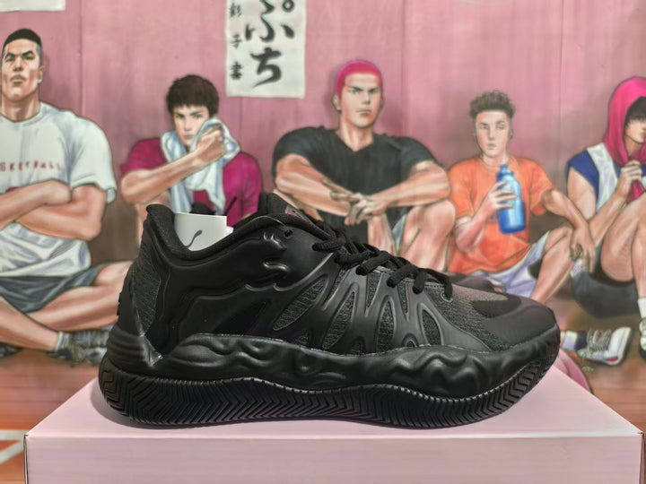 Black lace-up basketball sneaker shown from the side, highlighting layered panels and a sculpted outsole.