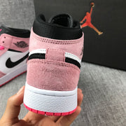 Close-up rear view showing the pink heel panel, black collar, white midsole and pink outsole.