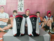 Rear view of the pair showing black heel panels with Jumpman branding and the number 23, plus red collar and heel accents.