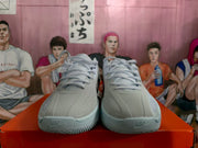 Front view of the pair showing the lace-up construction, perforated forefoot panels, Nike toe branding, and textured outsoles.