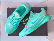 Pair of turquoise Kobe 5 Protro shoes shown from above and the side.