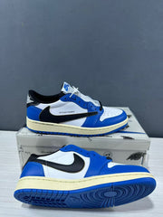 Pair of blue and white low-top sneakers shown from the side on a branded shoe box.