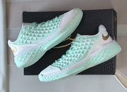 Side views of the Nike Kobe 3 pair displayed on a black box