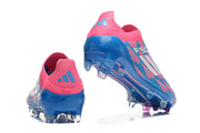 Heel views of pink and blue F50 soccer cleats, showing the heel details and outsole.