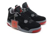 Pair of sneakers with black uppers, grey details, red outsoles and attached hangtag.