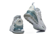 Rear and outsole views of white Nike Air Max 270 Premium sneakers with teal-toned heel units.