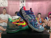 Side view of mismatched multicolor Nike basketball shoes with graphic panels and contrasting laces.