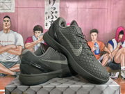 Angled side view showing the textured black upper, sculpted midsole and visible Zoom branding.