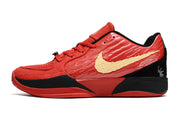 Side view of red Nike Ja 2 shoe with gold accents and black heel detail