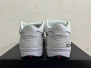 Rear view of white Kobe basketball shoes with patterned heel panels and signature-style detailing