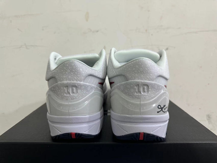 Rear view of white Kobe basketball shoes with patterned heel panels and signature-style detailing
