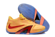 Basketball shoes shown from the side beside an upturned blue textured outsole