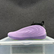 Side view highlighting the sculpted purple upper and matching outsole