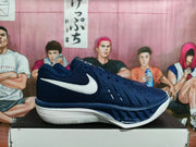 Side view of a navy basketball shoe with a white Swoosh logo
