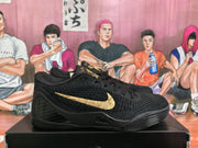 Side view of a black basketball sneaker with a gold Nike Swoosh.