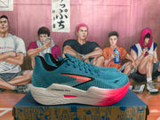 Side profile of a teal Brooks Hyperion Max running shoe with pink accents and a white midsole