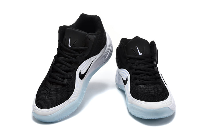 Pair of black and white Nike sneakers shown from the front, with translucent light-blue outsoles.