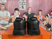 Rear view of black Nike basketball sneakers showing perforated heel panels and “001” heel markings.