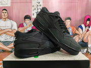 Pair of black Nike sneakers displayed at an angle, showing the side panels and heel branding.