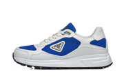 Side profile of a white and blue lace-up sneaker with a triangular logo plaque.