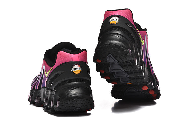 Rear and outsole views of pink, purple, and black Nike Air Max DN8-style sneakers