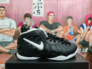 Side profile of a black high-top sneaker with a white Swoosh, ribbed sculpted side panel and white outsole.