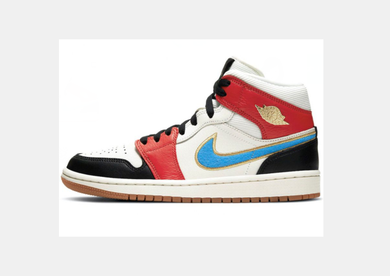 Side view of white Jordan mid-top sneakers with red panels, a blue Swoosh, black overlays, black laces, and a gum-colored outsole.