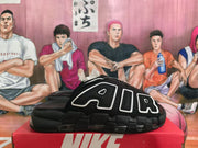 Side profile of a black slide showing oversized AIR lettering and a visible cushioning unit.