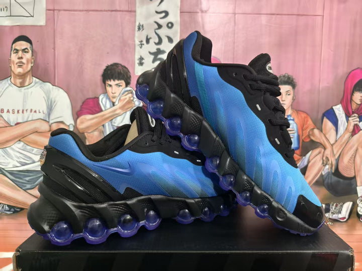 Pair of blue and black Nike Air Max sneakers shown at an angle, with translucent purple outsole elements.