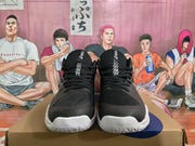 Front view showing the black laces, mesh tongues, patterned toe panels, and white outsoles.