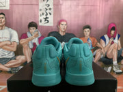 Rear view of lake blue Nike sneakers showing padded collars, tonal stitching, and matching midsoles.