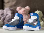 Front view of the pair showing white laces, gray toe panels, and blue collars.