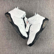Pair of white and black high-top sneakers displayed from above with perforated side panels.