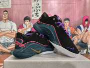 Angled view of black Nike basketball shoes with purple laces, teal panels, pink-red trim, and white soles