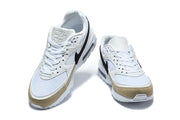 Front view of a pair of white Nike Air Max BW sneakers with black Swooshes