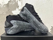 Pair of black and grey Adidas high-top basketball shoes shown from the side.