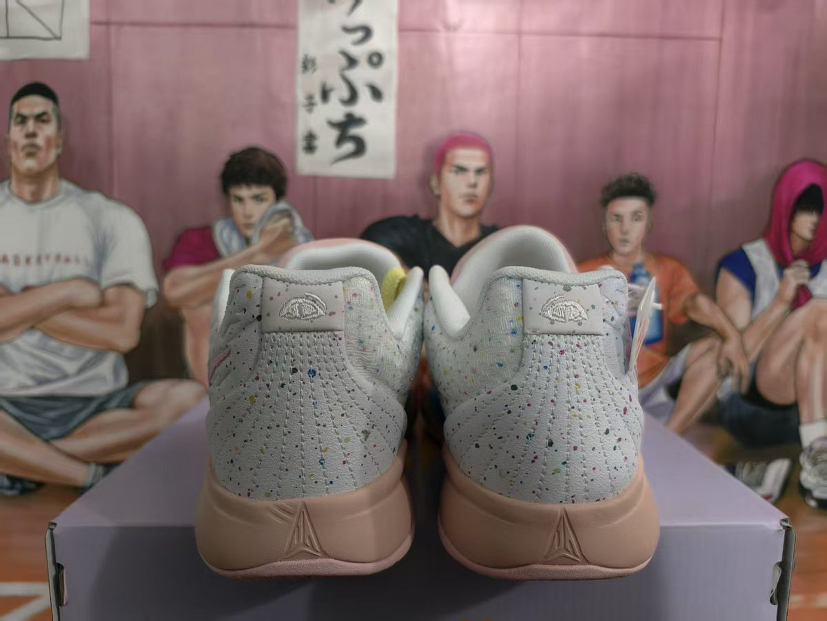 Rear view of multicolor Nike Sabrina 2 basketball shoes with speckled gray panels and pink midsoles.
