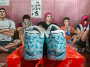Rear view showing the padded heels and patterned blue-and-white upper of the Nike basketball sneakers.