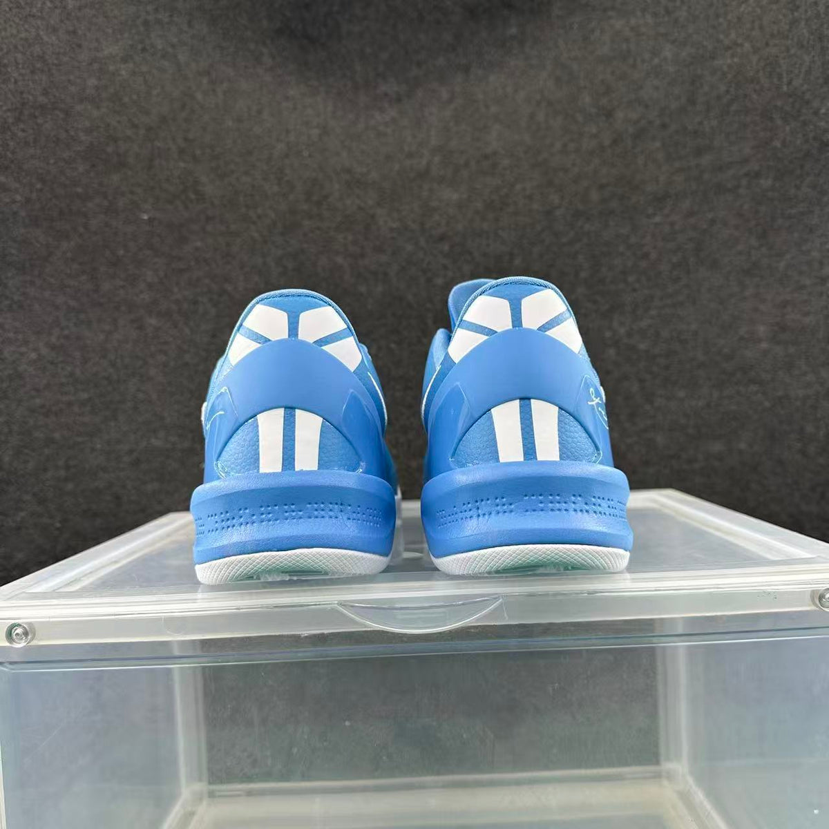 Rear view of blue and white low-top basketball shoes
