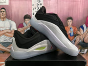 Angled view of the pair highlighting the contrasting black upper, white side panels and outsole.