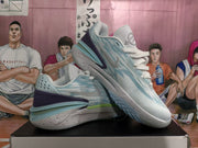 Pair of light blue basketball sneakers displayed together, showing the patterned side panels, layered heel structure, and textured outsole.
