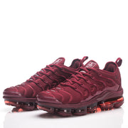 Pair of burgundy Nike sneakers shown from the front at an angle.