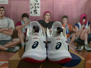 Rear view of white ASICS METARISE volleyball shoes with red outsole accents