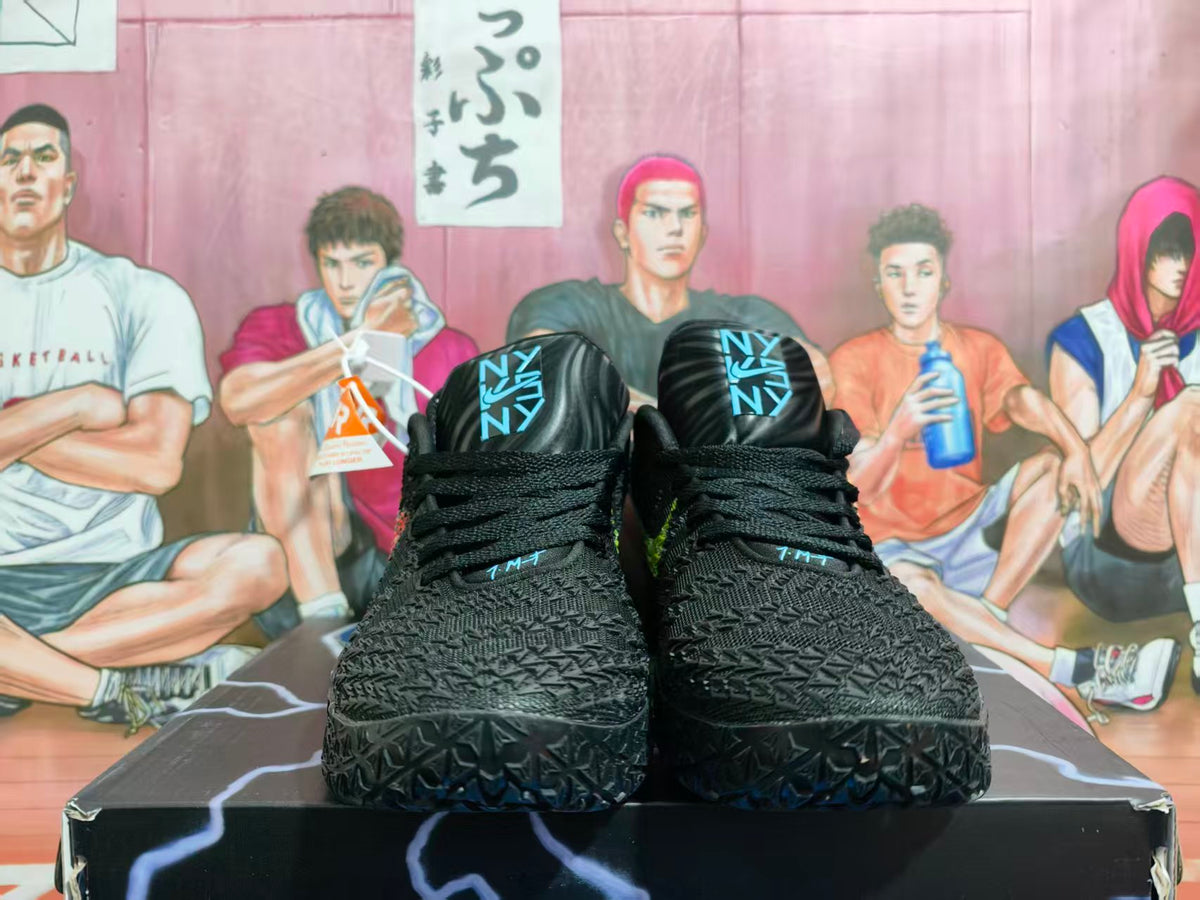 Front view of black Nike LeBron 12 basketball shoes with blue tongue details.