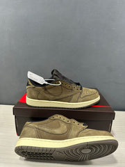 Angled view showing the sneaker upper, outsole, and cream midsole.