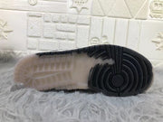 Close-up of the outsole showing black forefoot traction and a translucent midfoot section.